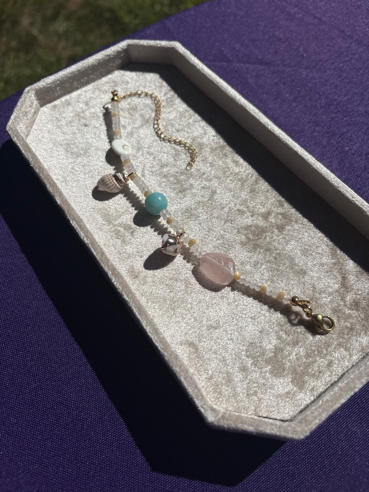 Amazonite, Rose Quartz, Shiva Shell, Mother of Pearl, Dotted Snail Shell, and Spiky Conch shell charm bracelet
