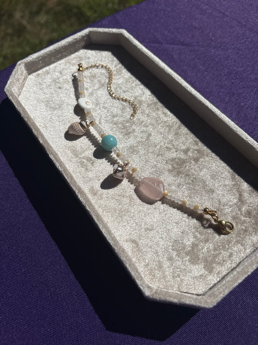 Amazonite, Rose Quartz, Shiva Shell, Mother of Pearl, Dotted Snail Shell, and Spiky Conch shell charm bracelet