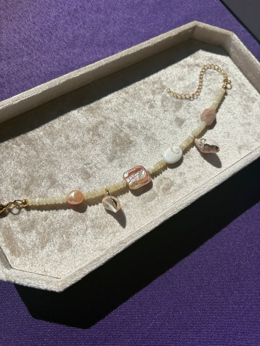 Yellow Calcite, Peach Moonstone, Shiva Shell, Pink Freshwater Pearls, Dotted Snail Shell, Spiky Conch shell bracelet